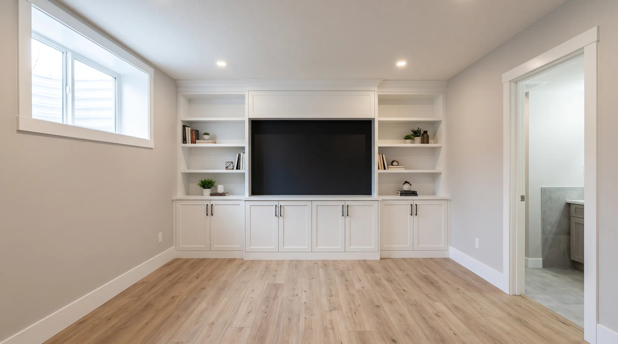 The same basement with the pot lights in and on